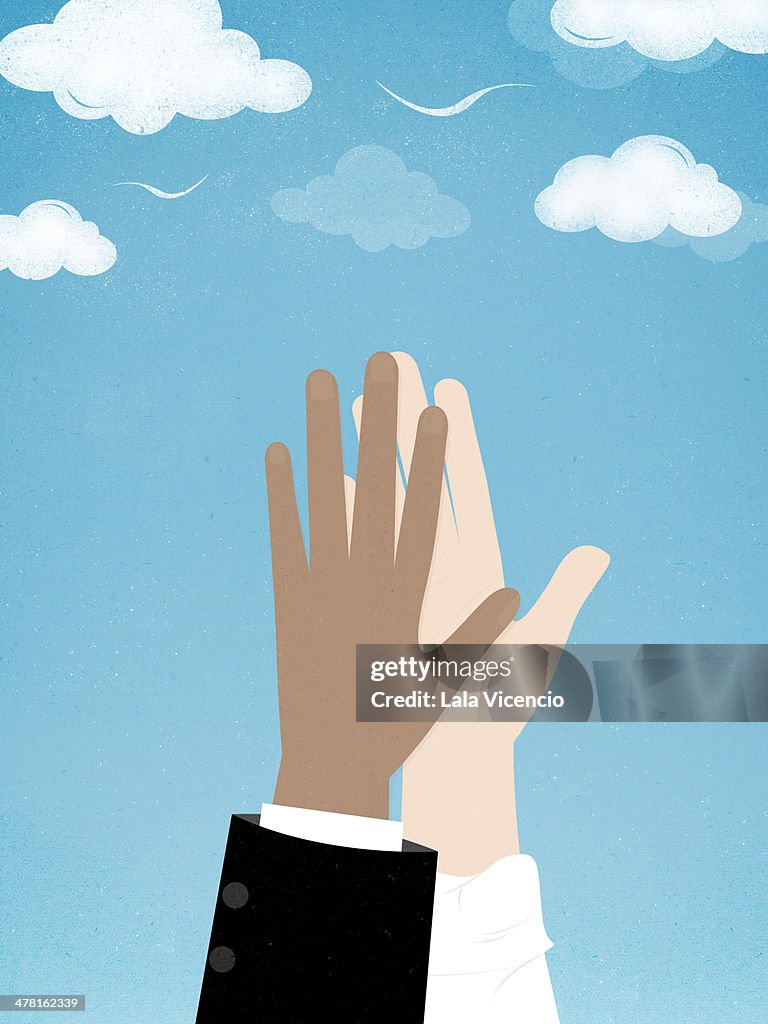 Two people giving a high five