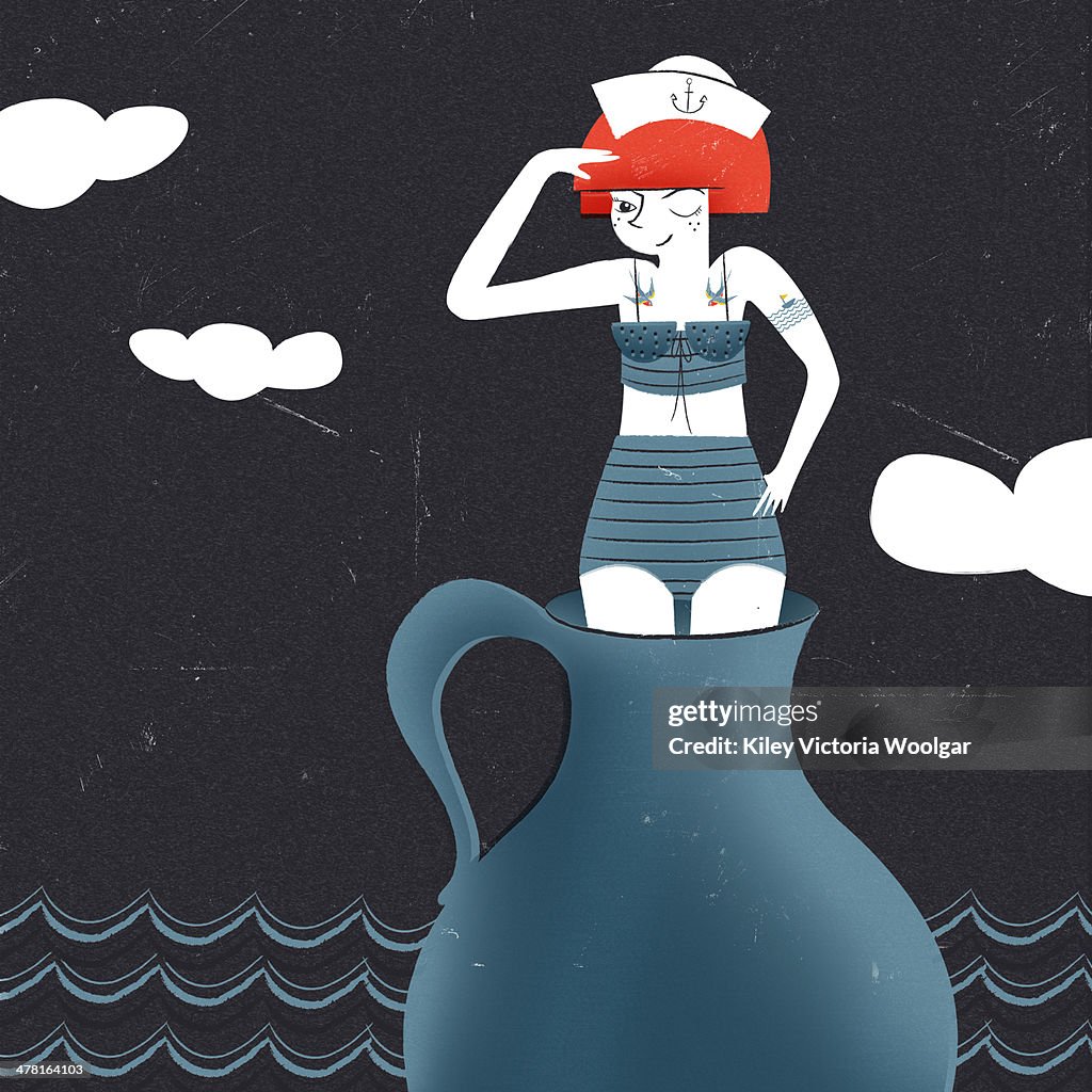 A young woman dressed as a sailor standing in a vessel