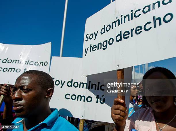 Dominicans of Haitian descent protest outside the House of Representatives asking to be returned their Dominican identity documents that were...