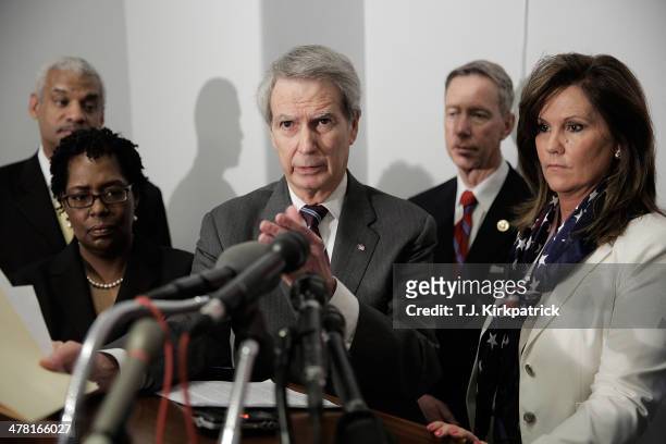 Rep. Walter Jones , center, speaks during a press conference with Emanuel Lipscomb, from left, a survivor of the World Trade Center terrorist attack,...