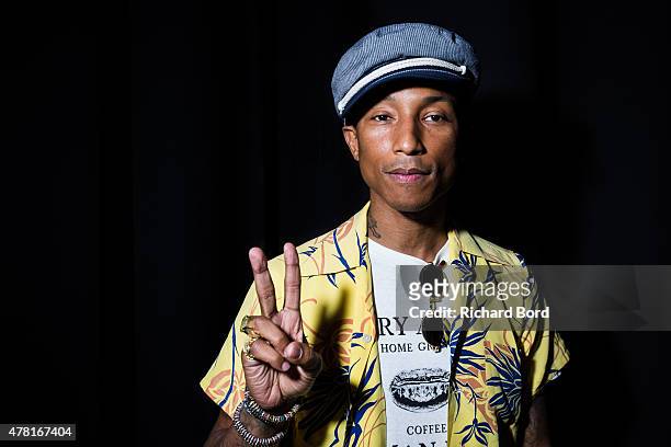 Pharrell Williams poses backstage as iHeartMedia hosts the main stage fireside chat about creativity with radio and television host and producer Ryan...
