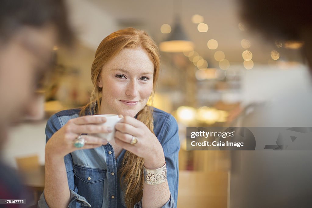 Friends enjoying coffee in cafe