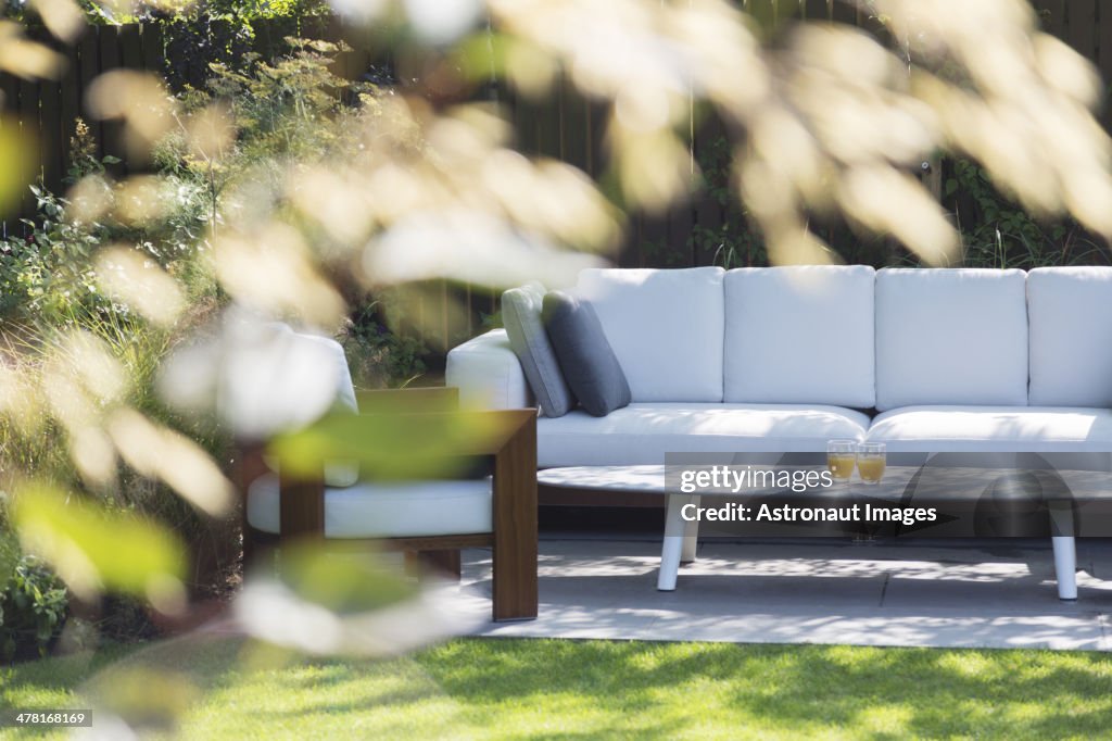 Sofa and armchair in backyard