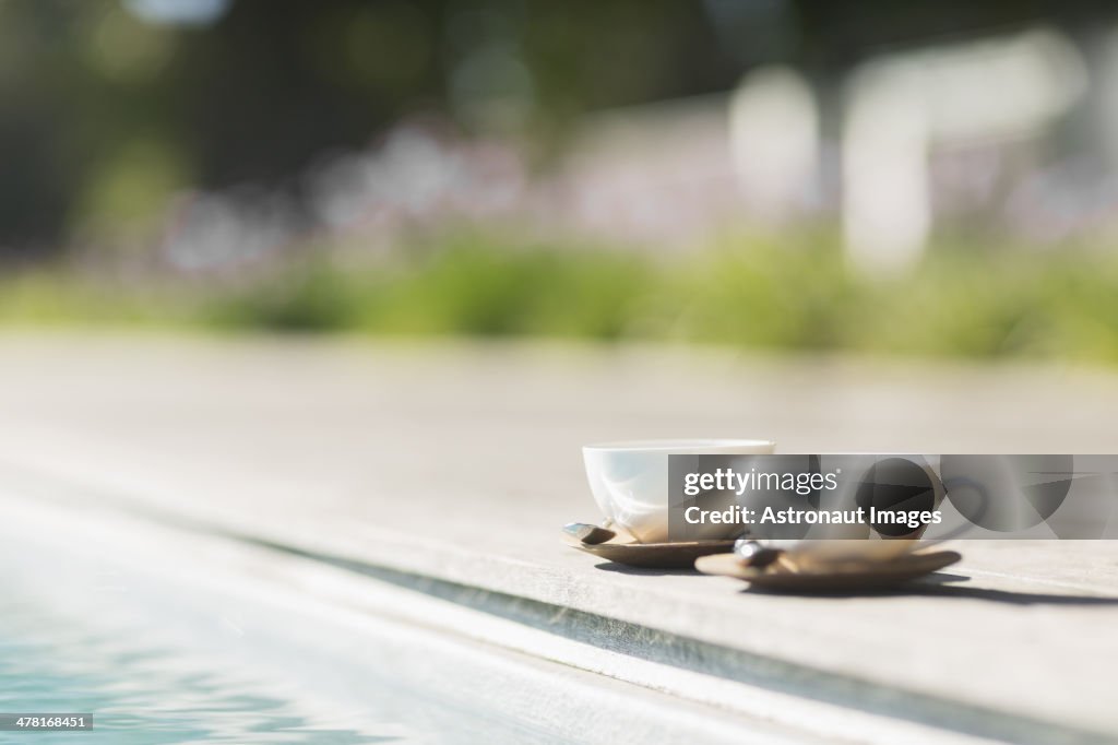 Cappuccino cups at poolside