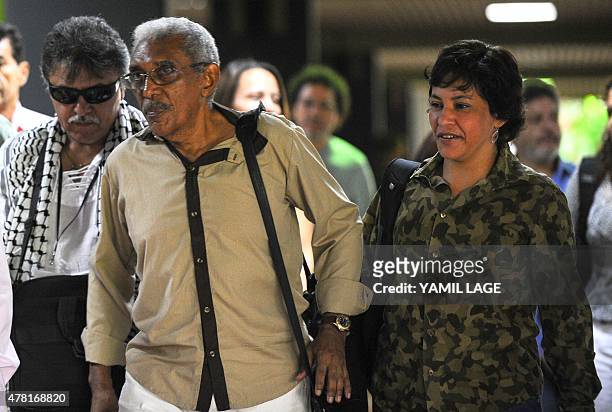 Members of the FARC-EP leftist guerrilla delegation, Commander Joaquin Gomez and guerrilla fighter Maritza Garcia arrive at Convention Palace in...