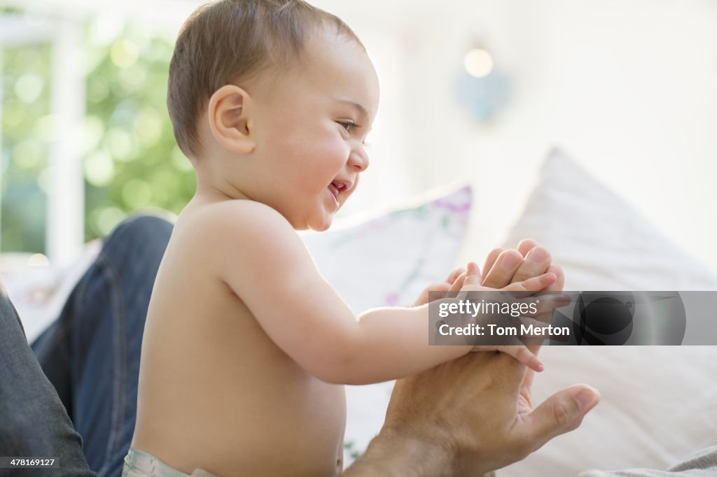 Father playing with baby boy