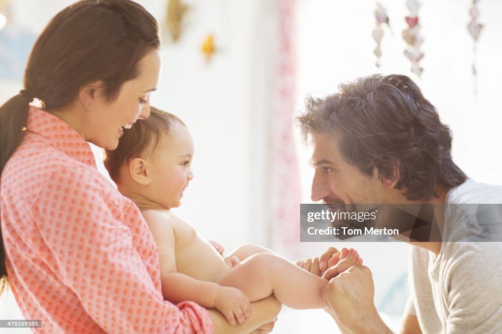 Parents playing with baby boy