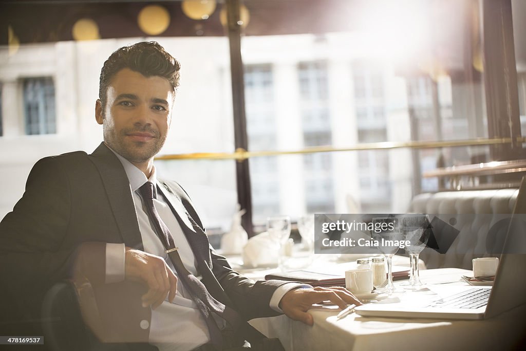 Businessman smiling in restaurant