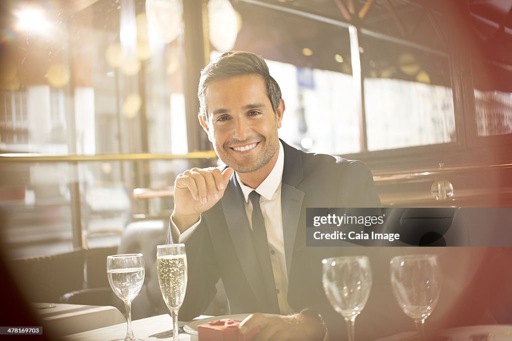 Businessman smiling at restaurant