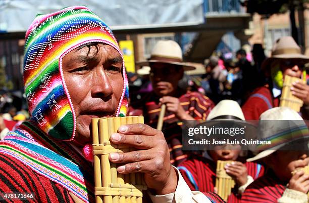 Man plays the panpipe during celebration of the Andean-Amazonic New Year 5523 on June 21, 2015 in El Alto, La Paz, Bolivia.