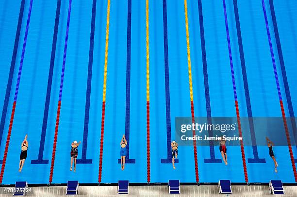 Competitors leap off the starting blocks in the Women's 100m Freestyle Semifinals during day eleven of the Baku 2015 European Games at the Baku...