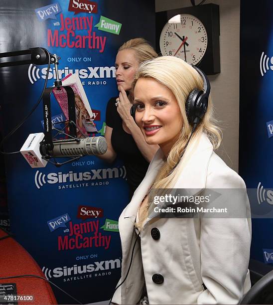 Holly Madison poses for a photo with host Jenny McCarthy during a visit to 'Dirty, Sexy, Funny with Jenny McCarthy' at SiriusXM Studios on June 23,...