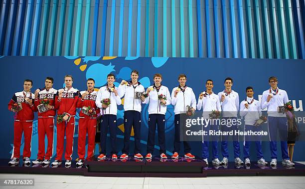 Bronze medalists Russia, Gold medalists Great Britain and silver medalists Italy celebrate on the medal podium for the Men's 4 x 100m Freestyle Relay...