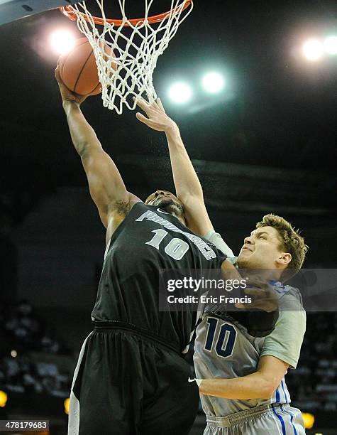 Kadeem Batts of the Providence Friars drives to the basket past Grant Gibbs of the Creighton Bluejays during their game at CenturyLink Center on...