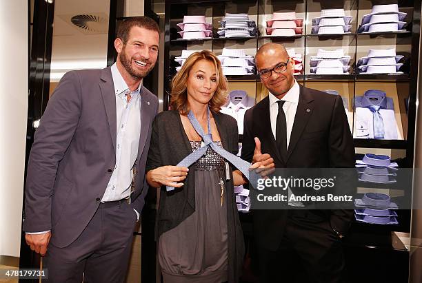 Simon Boeer, Caroline Beil and Pierre Geisensetter attend the Pohland store opening on March 12, 2014 in Dortmund, Germany.