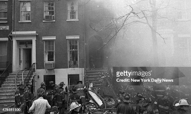 Greenwich Village townhouse is a pile of smoldering rubble after three blasts destroyed the building just before noon. The building, at 18 W. 11th...