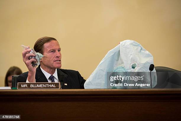 Sen. Richard Blumenthal holds up an airbag and inflator during a Senate Commerce, Science, and Transportation Committee hearing entitled ÒUpdate on...