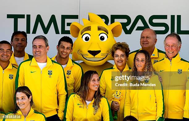 President Dilma Rousseff of Brazil poses with Ginga, the Brazilian national Olympic team's new mascot and Olympic team members after Ginga was...