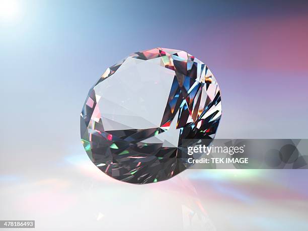 diamond refracting light - diamond gemstone stock pictures, royalty-free photos & images