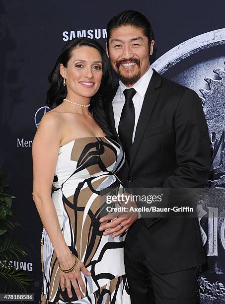 Actors Brian Tee and Mirelly Taylor arrive at the World Premiere of 'Jurassic World' at Dolby Theatre on June 9, 2015 in Hollywood, California.