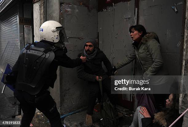 Riot police uses water cannons against protesters during clashes at the funeral of Berkin Elvan on March 12, 2014 in Istanbul. Riot police fired tear...