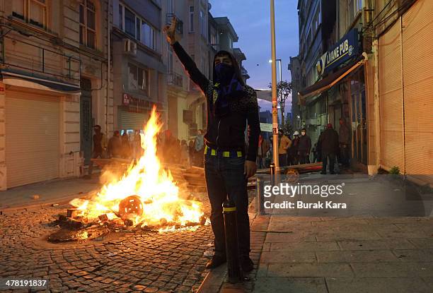 Riot police uses water cannons against protesters during clashes at the funeral of Berkin Elvan on March 12, 2014 in Istanbul. Riot police fired tear...