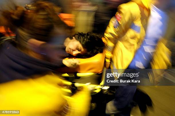 Injured protestor carried to ambulance by health crew personel as Turkish riot police uses water cannons against protesters during clashes at the...