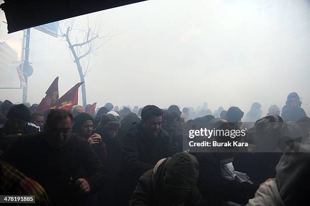 Riot police uses water cannons against protesters during clashes at the funeral of Berkin Elvan on March 12, 2014 in Istanbul. Riot police fired tear...