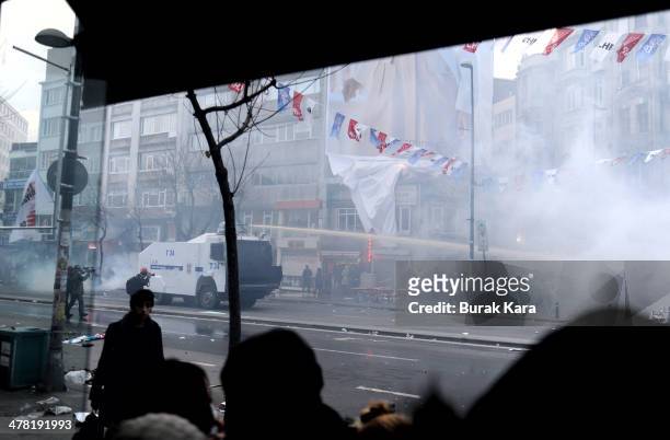 Riot police uses water cannons against protesters during clashes at the funeral of Berkin Elvan on March 12, 2014 in Istanbul. Riot police fired tear...