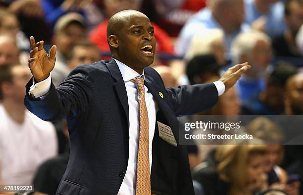 Head coach James Johnson of the Virginia Tech Hokies watches on against the Miami Hurricanes during the first round of the 2014 Men's ACC Basketball...