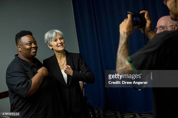 Jill Stein poses for a photo with a supporter after she announced that she will seek the Green Party's presidential nomination, at the National Press...