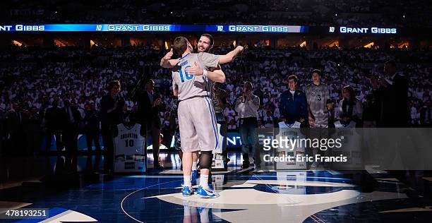 Grant Gibbs and Ethan Wragge of the Creighton Bluejays hug during senior day ceremonies after their game against the Providence Friars at CenturyLink...