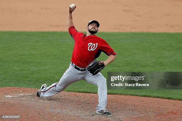 Clay Hensley of the Washington Nationals throws a pitch in the sixth inning of a game against the Atlanta Braves at Champion Stadium on March 12,...
