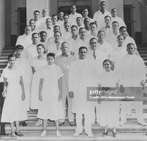 Interns, residents, and assistant residents at Freedmen's Hospital in front of Washington annex, Washington DC, June 13, 1952. Pictured are Rose D...