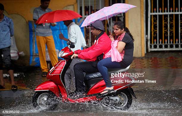 Motorists drives through heavy rain in Ghatkopar on June 23, 2015 in Mumbai, India. According to the weather forecast intermittent rain or showers...