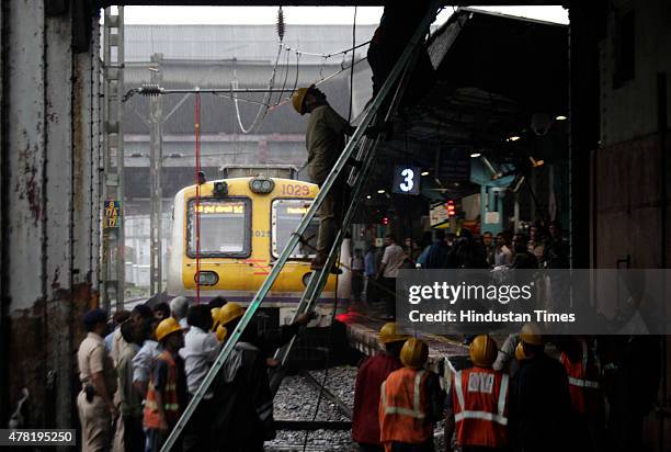 Repair work underway as overhead wire snapped near Dadar railway station on June 23, 2015 in Mumbai, India. Trains on western line are delayed by 15...