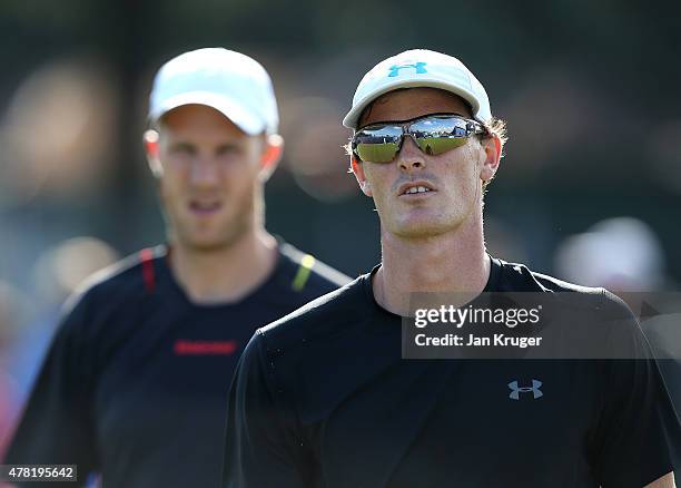 Jamie Murray and Dominic Inglot of Great Britain look on in their doubles match against Thomaz Bellucci and Marcelo Melo of Brazil on day three of...