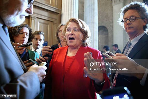 Sen. Heidi Heitkamp talks with reporters following the weekly Democratic Senate policy luncheon at the U.S. Capitol June 23, 2015 in Washington, DC....