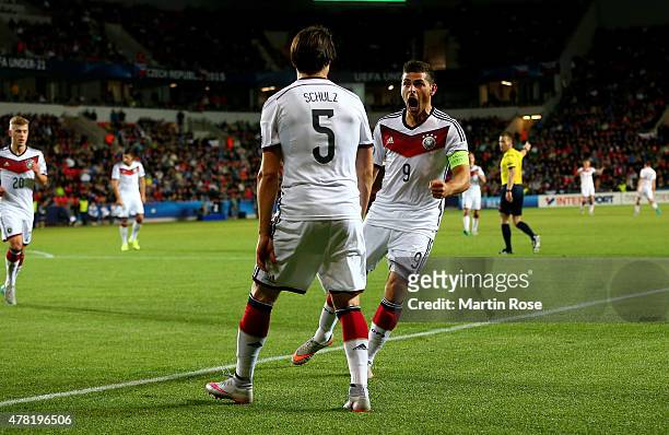 Nico Schluz of Germany celebrate with team mate Kevin Volland after scoring the opening goal during the UEFA European Under-21 Group A match between...