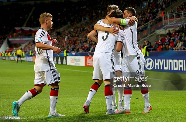 Nico Schluz of Germany celebrate with his team mates after scoring the opening goal during the UEFA European Under-21 Group A match between Germany...