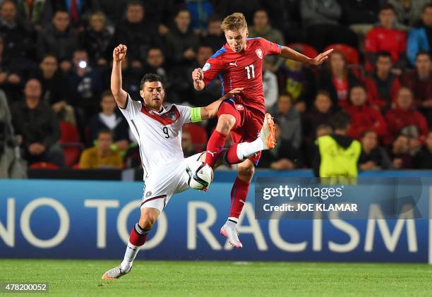 Czech Martin Frydek and Germany's captain Kevin Volland fight for a ball during the EURO U21 2015 group A match between Czech Republic and Germany at...