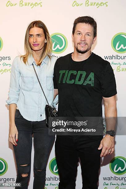 Model Rhea Durham and actor Mark Wahlberg attend the Wahlburgers Coney Island VIP Preview Party at Wahlburgers Coney Island on June 23, 2015 in New...