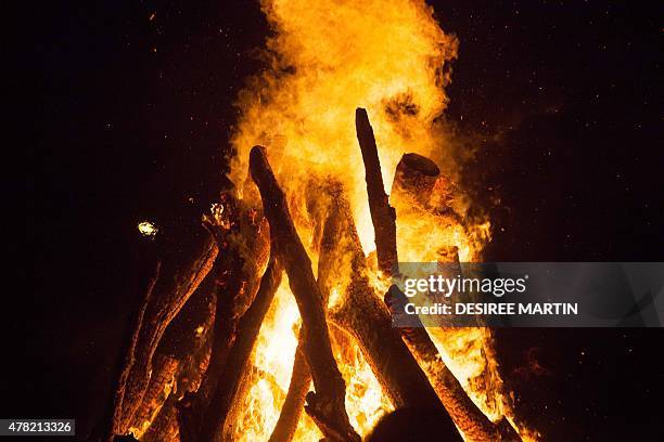 View of a bonfire during the traditional Saint John night, which coincides with the summer solstice, at the beach of Puerto de La Cruz, on the...