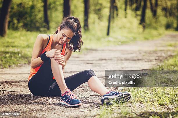 sport injury - human knee stock pictures, royalty-free photos & images