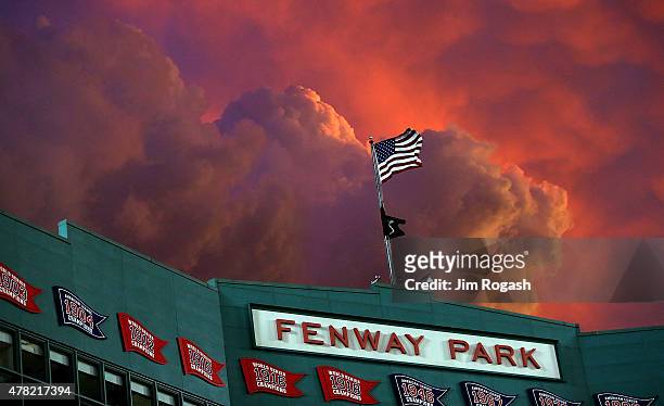 Twilight settles over Fewnay Park during a game between the Boston Red Sox and the Baltimore Orioles in the fourth inning at Fenway Park on June 23,...