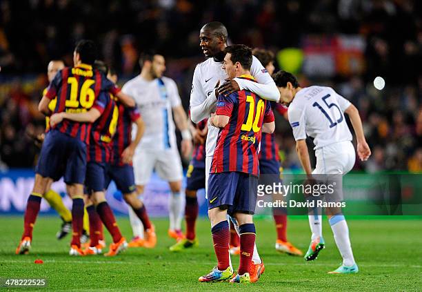 Yaya Toure of Manchester City hugs Lionel Messi of Barcelona following the final whistle during the UEFA Champions League Round of 16, second leg...