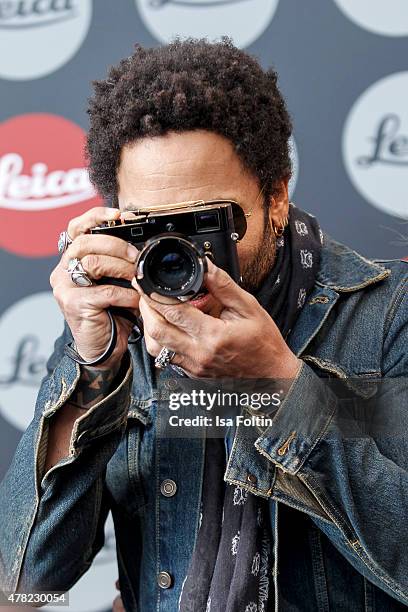 Lenny Kravitz takes a picture during the vernissage 'Flash by Lenny Kravitz' on June 23, 2015 in Wetzlar, Germany.