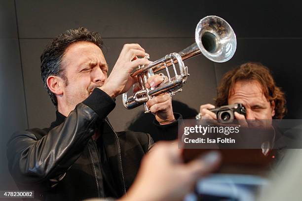 Till Broenner plays the trumpet during the vernissage 'Flash by Lenny Kravitz' on June 23, 2015 in Wetzlar, Germany.