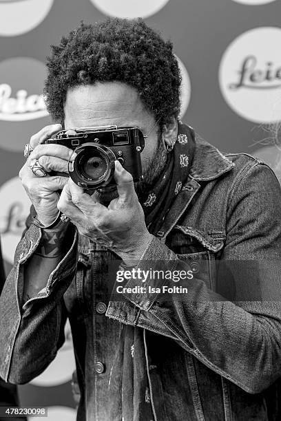 Lenny Kravitz takes a picture during the vernissage 'Flash by Lenny Kravitz' on June 23, 2015 in Wetzlar, Germany.