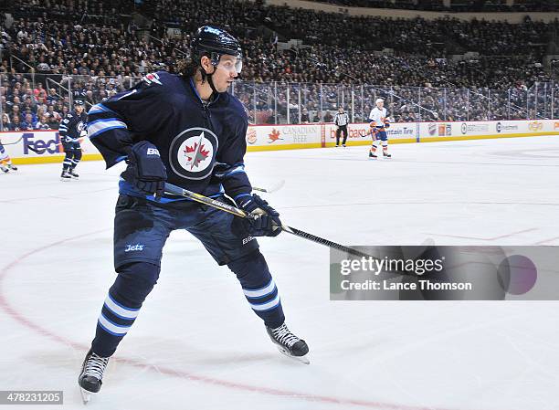 Keaton Ellerby of the Winnipeg Jets keeps an eye on the play during third period action against the New York Islanders at the MTS Centre on March 4,...